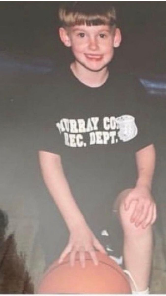 Young Tyler holding a basketball